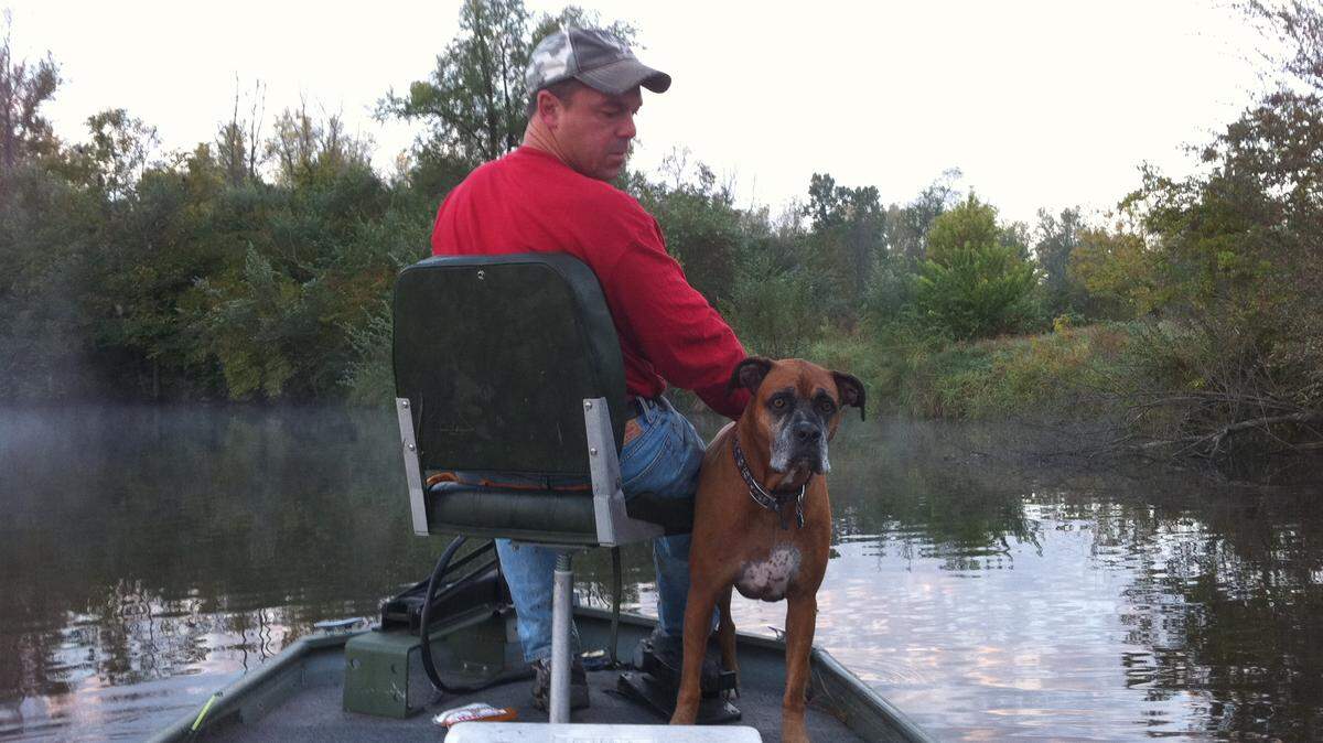 Dave Jordan, a New Baden police officer who died after being struck by a vehicle on a rural Clinton County road, with one of his beloved dogs, Misty.
