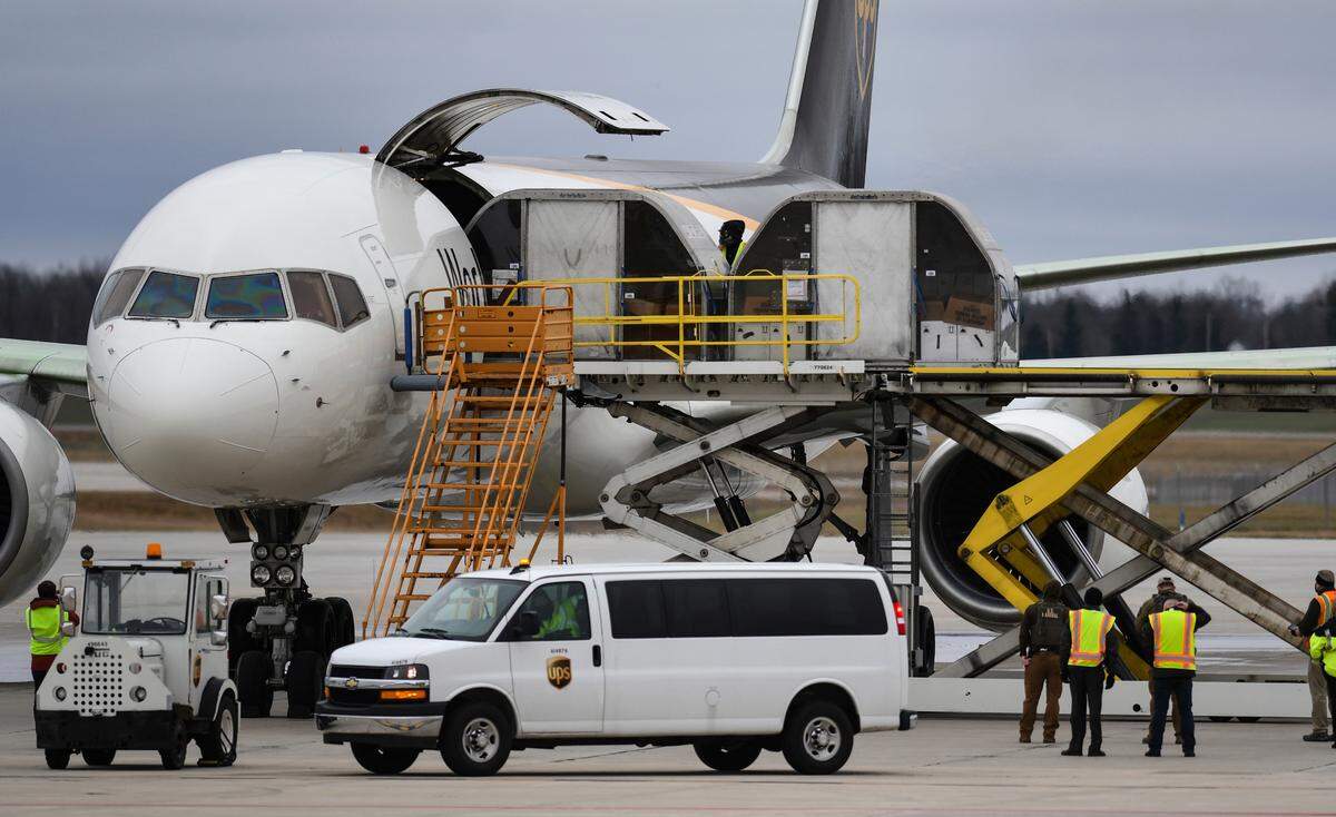 The first shipment of the Pfizer-BioNTech coronavirus vaccine is loaded onto a UPS jet on Sunday at Michigan’s UPS hub at Capital Region International Airport in Lansing, Mich. Supplies are expected to reach metro-east hospitals this week.