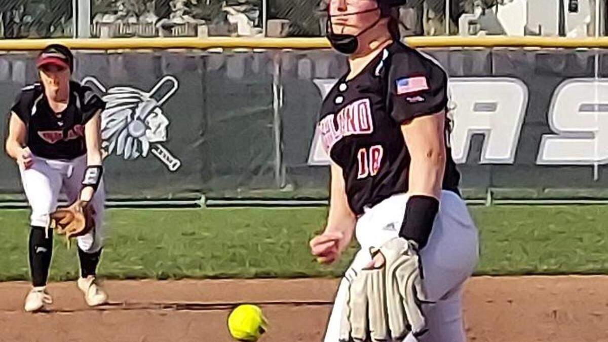 Kaitlyn Wilson of Highland spinning a pitch toward home plate at Mascoutah.