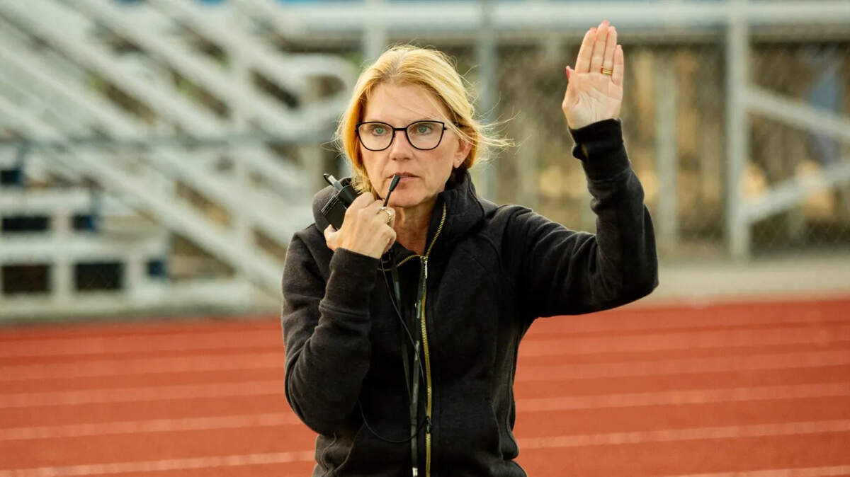 Melissa Gustafson-Hinds directing the marching band at O’Fallon Hight School.