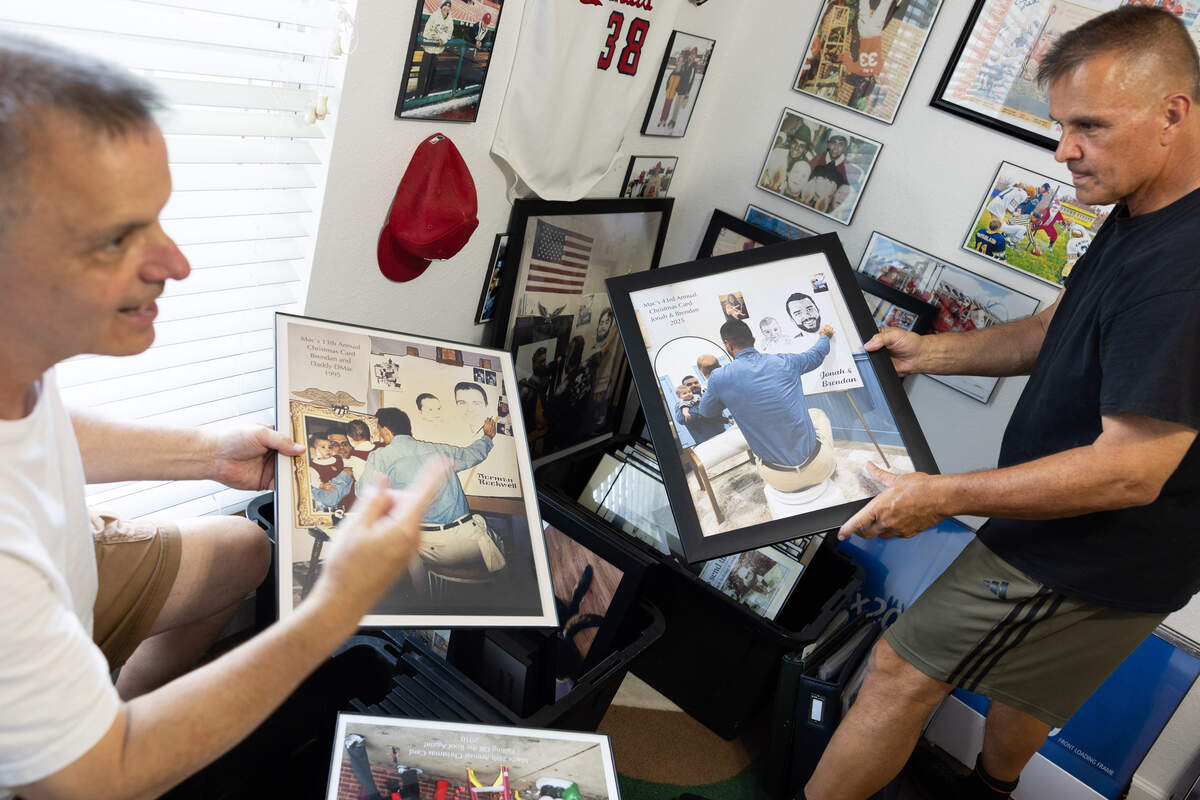 The McFarlan brothers display a set of cards meant to mimic the famous self-portrait painting of the American painter Norman Rockwell in Kevin Macfarlane’s Waterloo home on June 10, 2026.