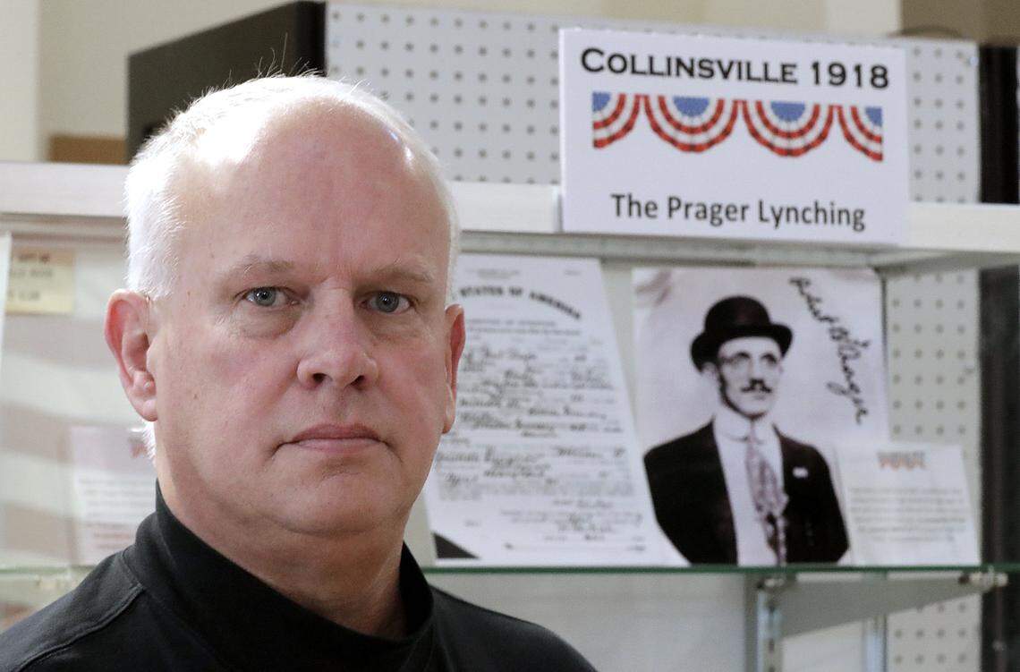 Collinsville Historical Museum board member Peter Stehman with part of the museum's exhibit about the lynching of Robert Prager in 1918.