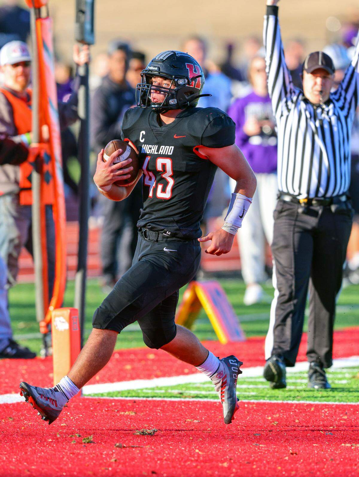 Highland’s Brenden Gelly runs in for a touchdown during a second round IHSA Class 5A postseason game against Mascoutah. The Indians ultimately prevailed 55-42 to advance into the quarterfinal round.