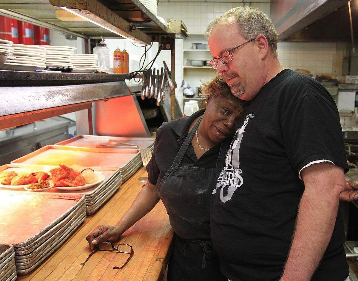 In this file photo from February 2017, Allen Irby consoles Fischer’s kitchen supervisor Wyvette Jones as she breaks down in tears on the last day of business at the popular Belleville restaurant.