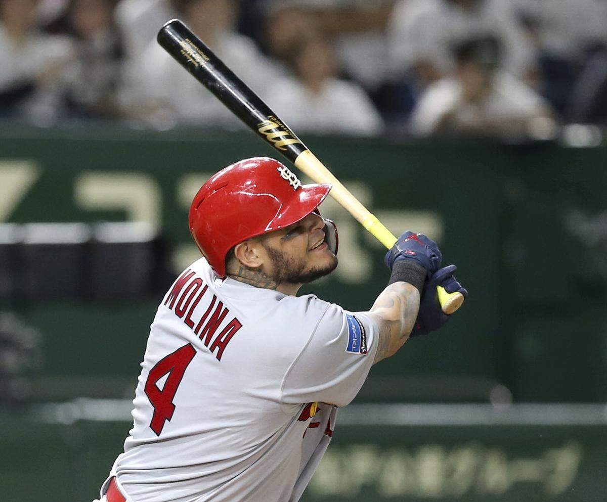 MLB All-Star Yadier Molina of the St. Louis Cardinals hits a three-run home-run off All Japan starter Shinsaburo Tawata in the fifth inning of Game 3 of their All-Stars Series baseball at Tokyo Dome in Tokyo, Sunday, Nov. 11, 2018. (AP Photo/Toru Takahashi)