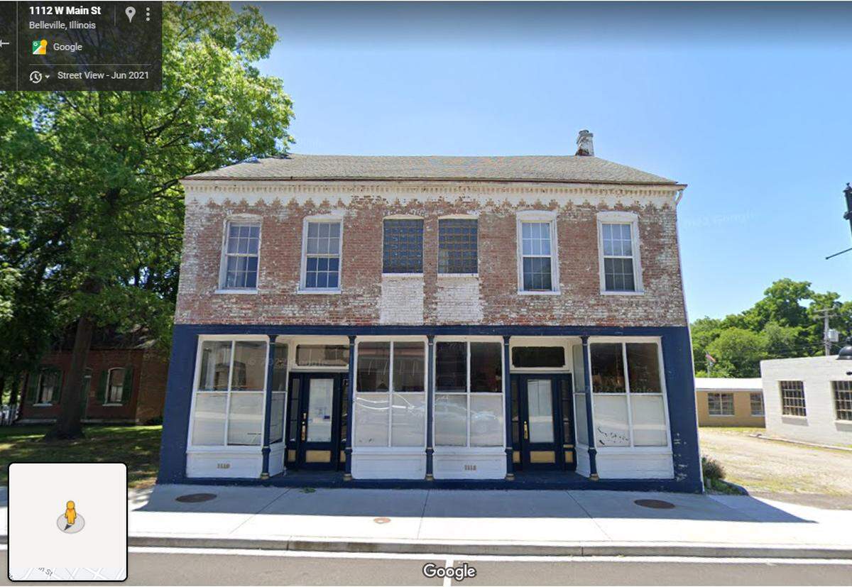 This file photo shows a historic building at 1112 W. Main St. (formerly 1110-1112) before its original storefront doors and windows were removed.