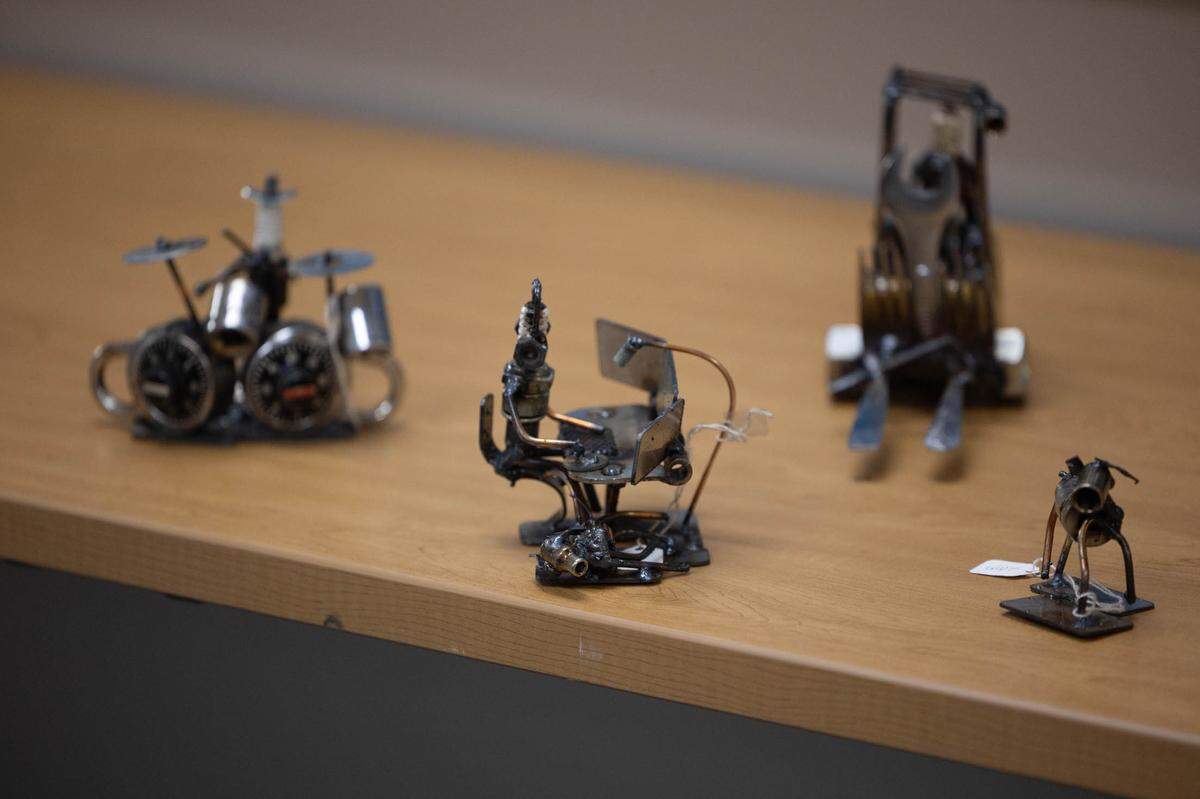 Some of Dick Cooley’s sculptures, all made from recycled parts, include drummers, computer gamers and forklifts. Cooley is known as the “Spark Plug Guy,” as the people in his sculptures are made of spark plugs.
