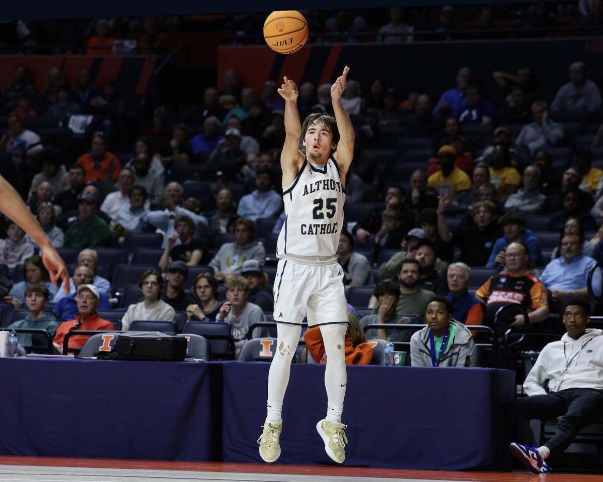 March 15, 2025 - , - Belleville Althoff’s Zach Winkeler takes a three point shot during the IHSA, 2A championship game against Chicago (Dyett) at the State Farm Center in Champaign. [Photo: Chris Johns]