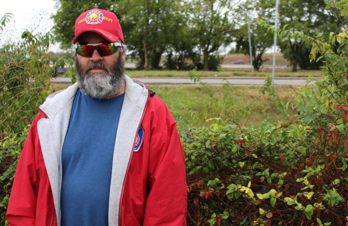 Washington Park resident Scott Rose works near the Interstate 64-Illinois 111 interchange, whose land used to be a black cemetery before it was moved in the 1960s.