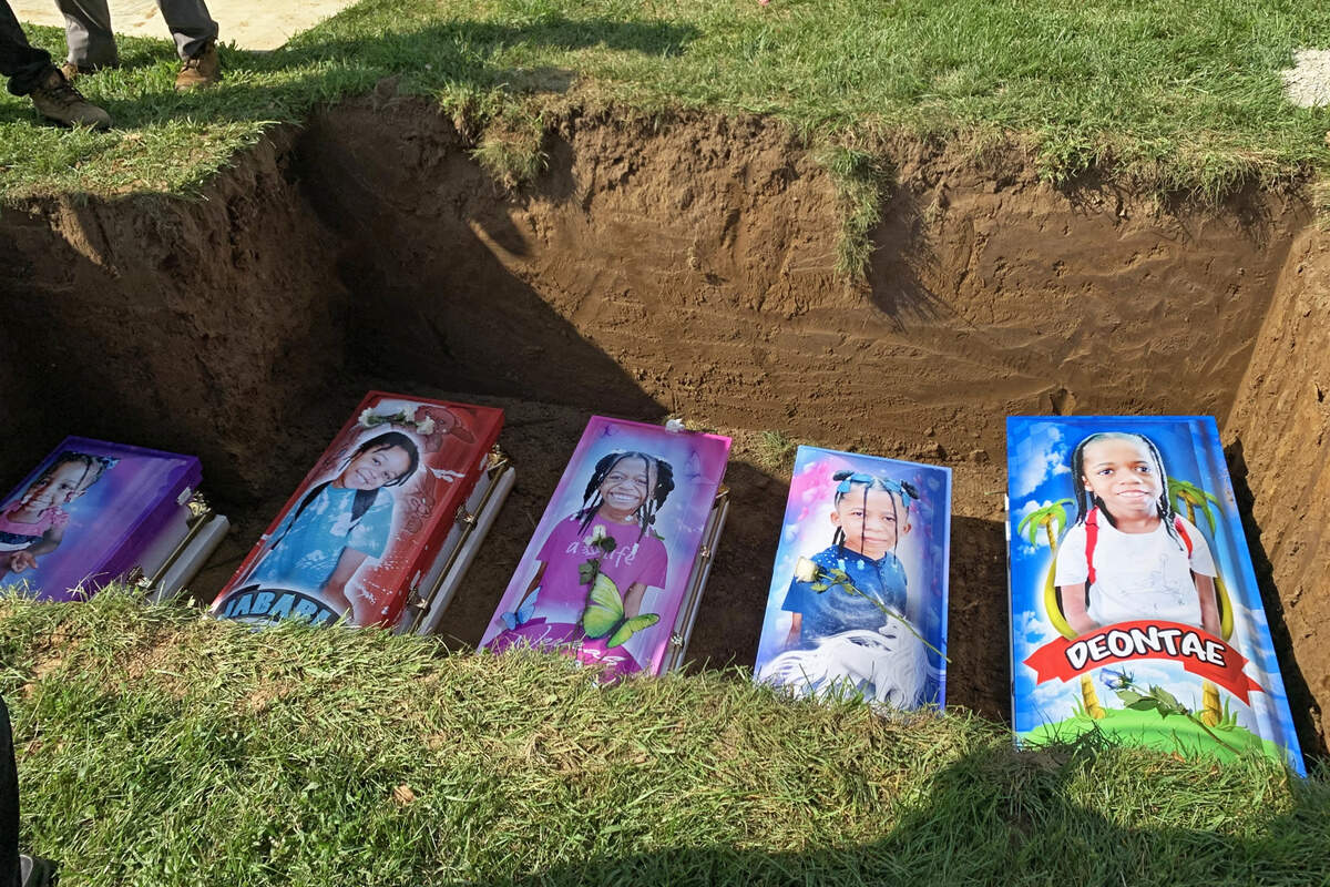 An apartment fire in East St. Louis left five children dead last August. Damian Ferek, president of CasketWraps, drove more than 600 miles from Morgantown, West Virginia, to southern Illinois to deliver five custom caskets ahead of the funeral for the children.