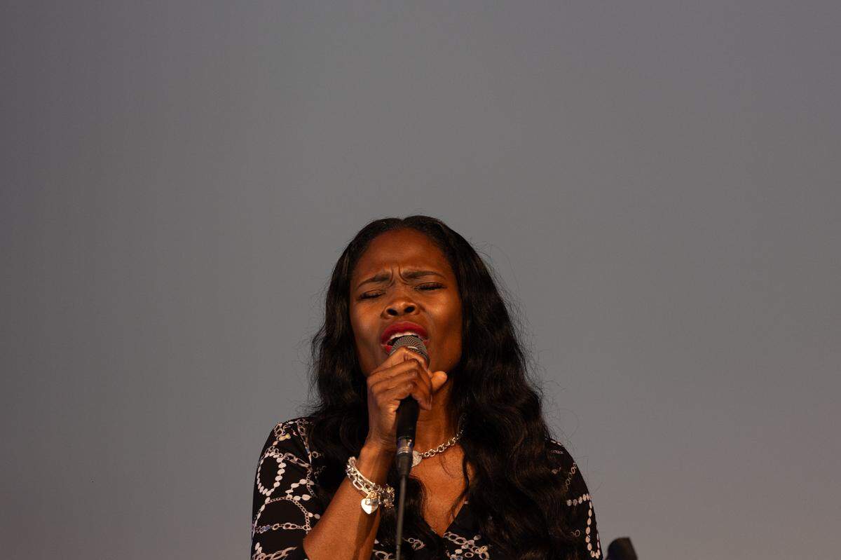 Tammy Jenkins, whose husband is a police officer, sings gospel during a memorial service for fallen police officers of St. Clair County in Christ Church on Frank Scott Parkway in Fairview Heights, Ill. on May 7, 2024.