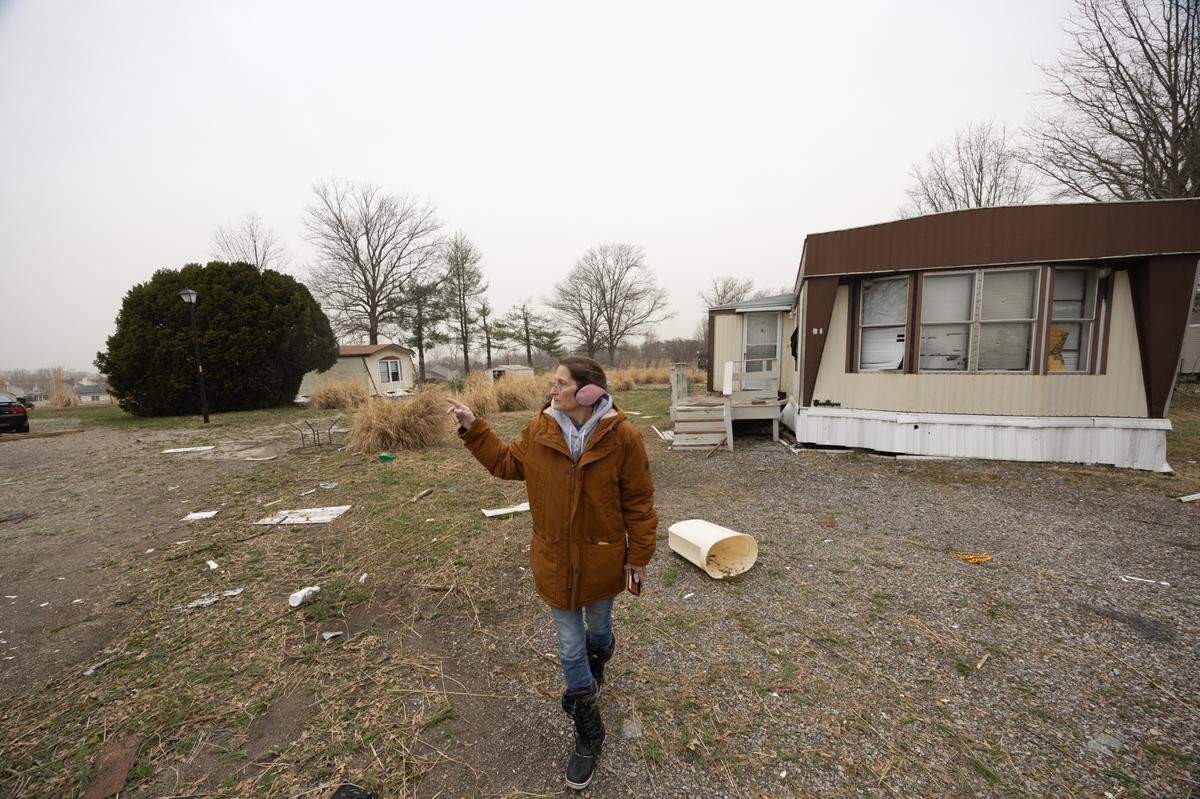 Linda Gaskill, a resident of Parkview Mobile Home Park, points out destruction after a suspected tornado passed through on Friday night. “It was horrible,” Gaskill said, “this is just really sad.”