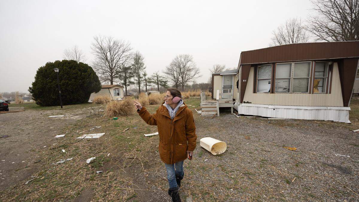 Linda Gaskill, a resident of Parkview Mobile Home Park, points out destruction after a suspected tornado passed through on Friday night. “It was horrible,” Gaskill said, “this is just really sad.”