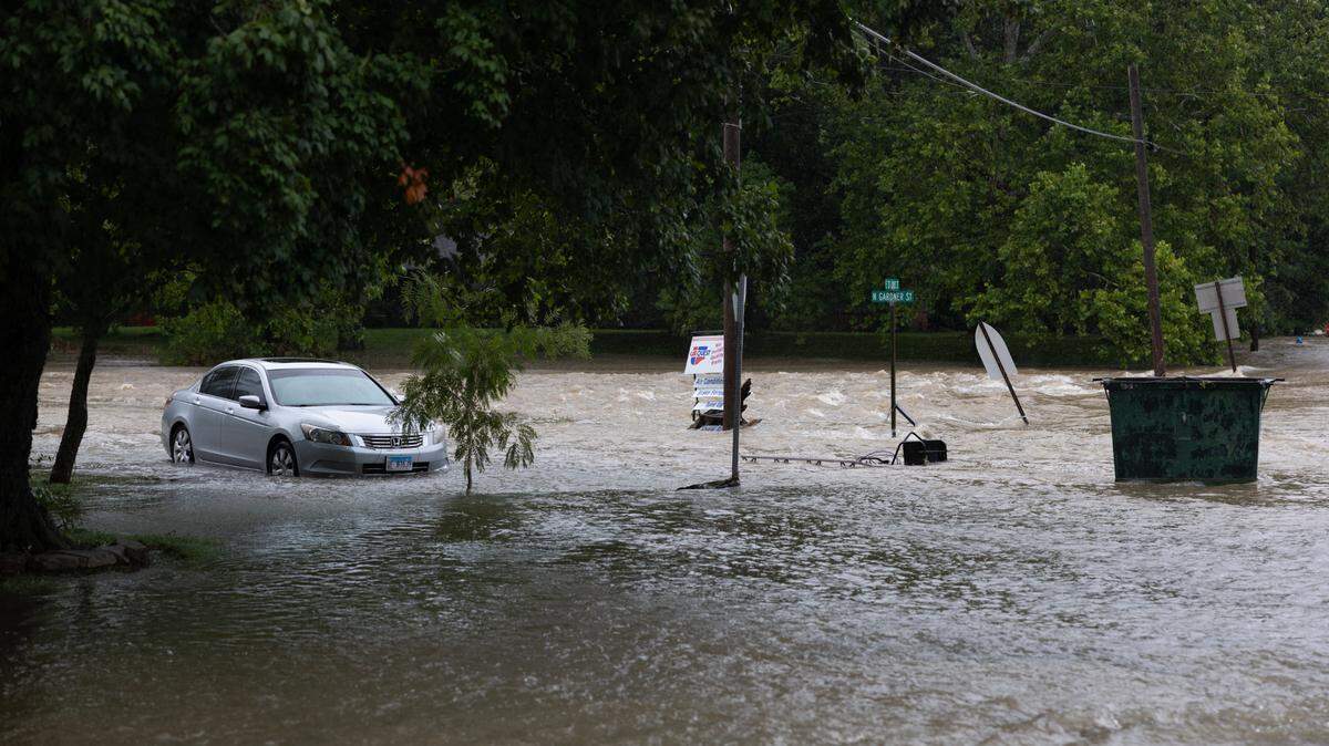 Flooding along E. St. Louis St. in Nashville, Ill., along the path where the dam spilled over, on July 16, 2024.