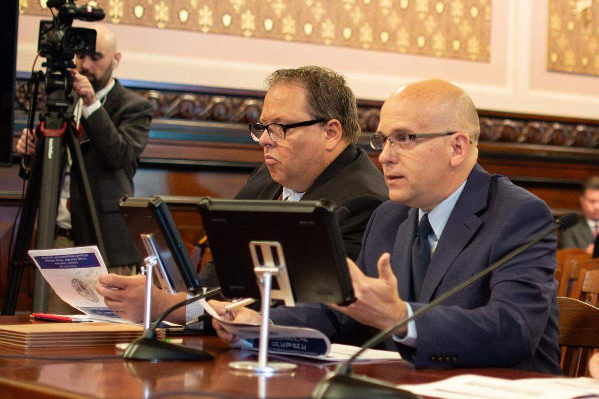 Commission on Government Forecasting and Accountability Revenue Director Eric Noggle, right, speaks to an Illinois Senate committee on Wednesday, May 13, 2026.