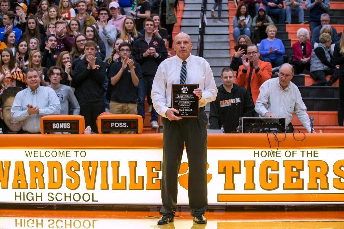 Longtime Edwardsville boys basketball coach Mike Waldo is honored at his last home game with the Tigers.