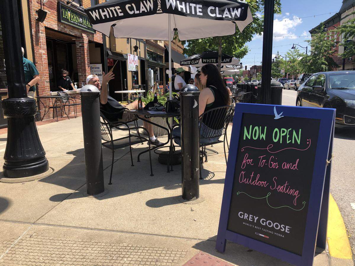 Customers at Tavern on Main, located at 301 E. Main St, in Belleville, eat lunch at the restaurant’s outdoor seating on the first day of Phase 3 of Restore Illinois, Gov. J.B. Pritzker’s plan to reopen the state.