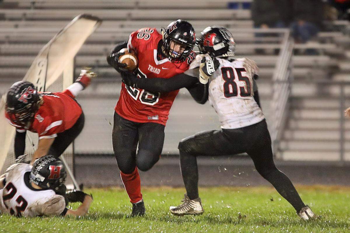 Triad’s Sam Yager tries to break free from Highland’s Eli Jones. He hopes to help the Knights’ reverse a three-game slide.