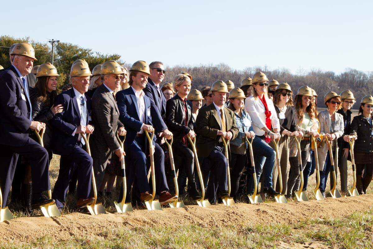 Representatives of Glik’s departments stores, The Korte Co. and the city of Collinsville pose for photos at a groundbreaking for a new Glik’s corporate headquarters on Wednesday.