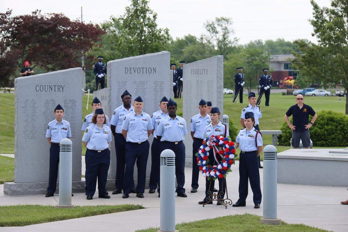O’Fallon Township High School Air Force Junior ROTC cadets place a wreath at the O’Fallon Veterans’ Monument during the Memorial Day program in O’Fallon. More than 150 spectators attended the event sponsored by the city and the monument association this year.