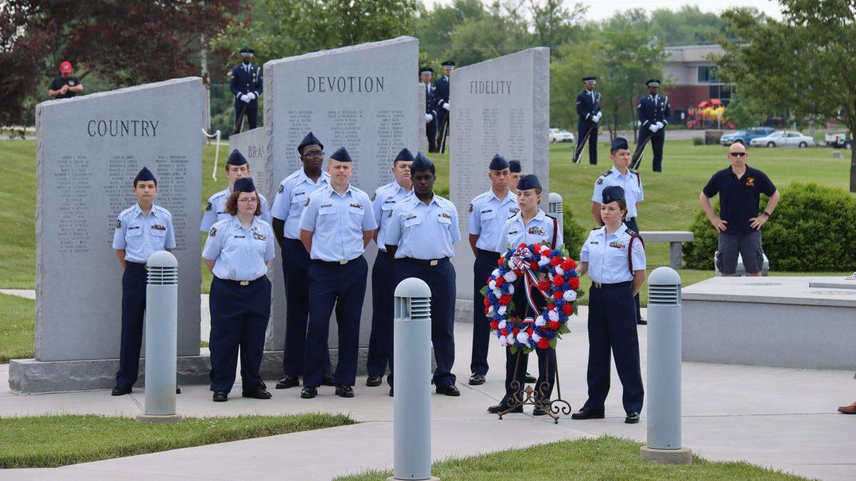 O’Fallon Township High School Air Force Junior ROTC cadets place a wreath at the O’Fallon Veterans’ Monument during last year’s Memorial Day program in O’Fallon.