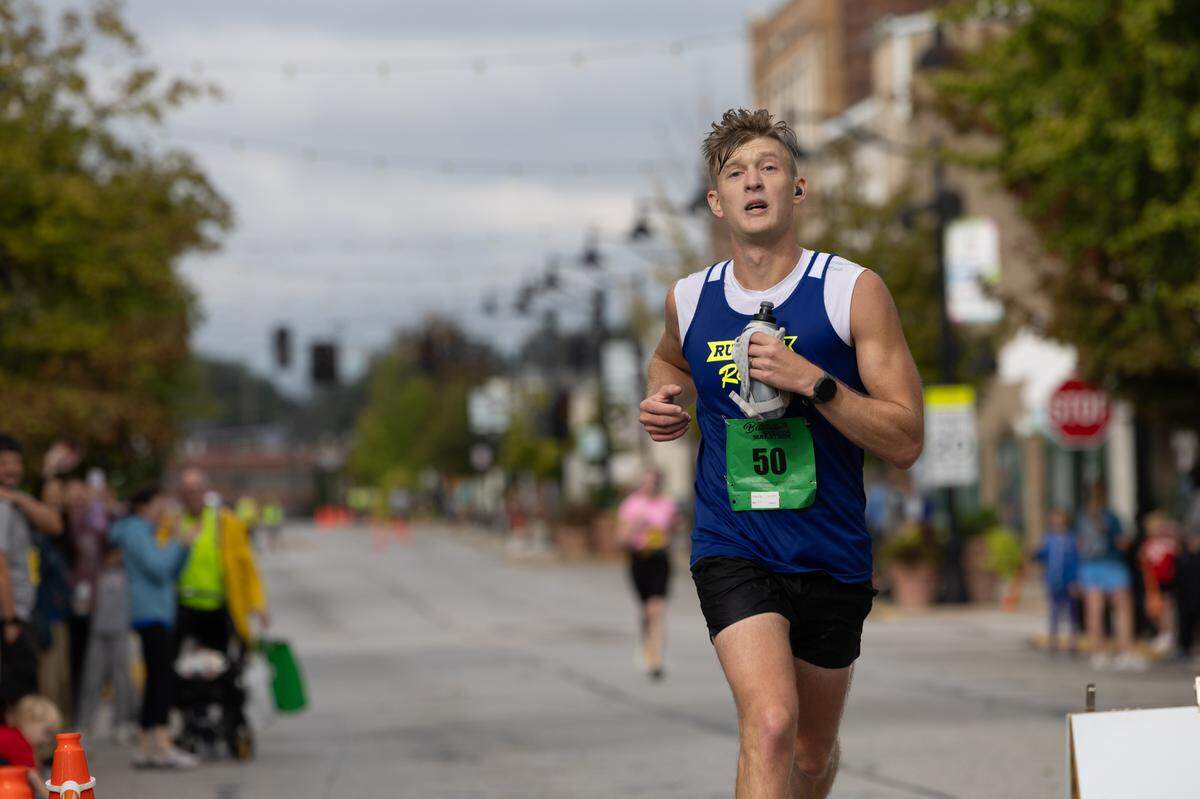 Men’s second-place winner Dusty Schulz crosses the finish line at the Belleville Marathon on Sept. 28, 2024.