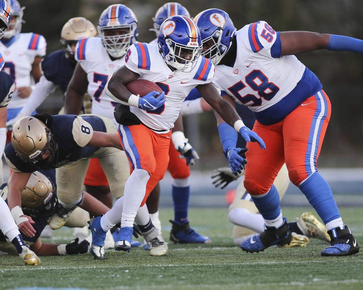 East St. Louis running back TaRyan Martin carries the ball during the IHSA Class 6A semifinals against Lemont. Martin helped lead the Flyers to a 32-29 victory and a spot in the state championship game.