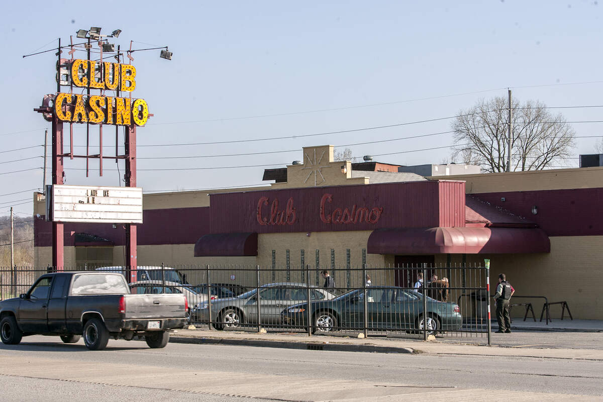 Police and investigators outside of Club Casino on March 29, 2010