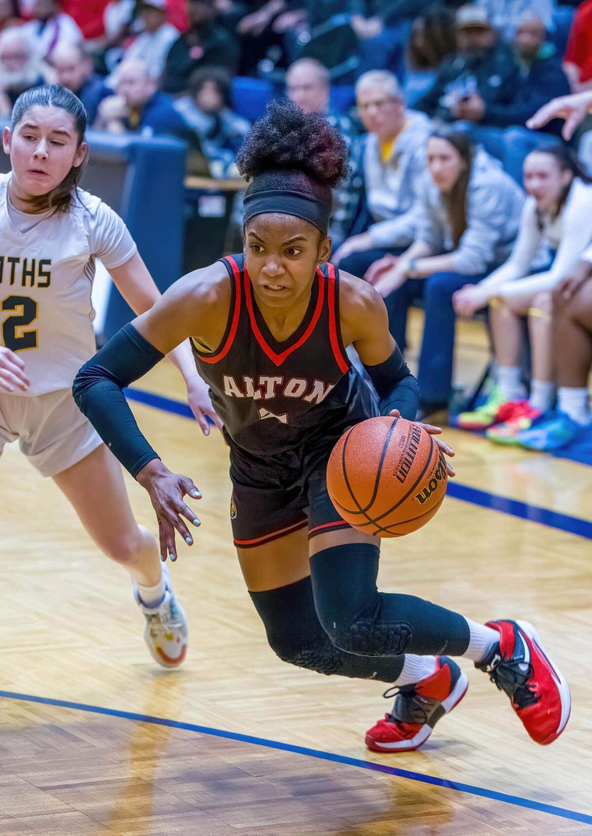 Alton’s Kaylea Lacey drives the baseline against O’Fallon during the IHSA Class 4A O’Fallon Sectional semifinals. The Panthers ultimately prevailed 49-43.