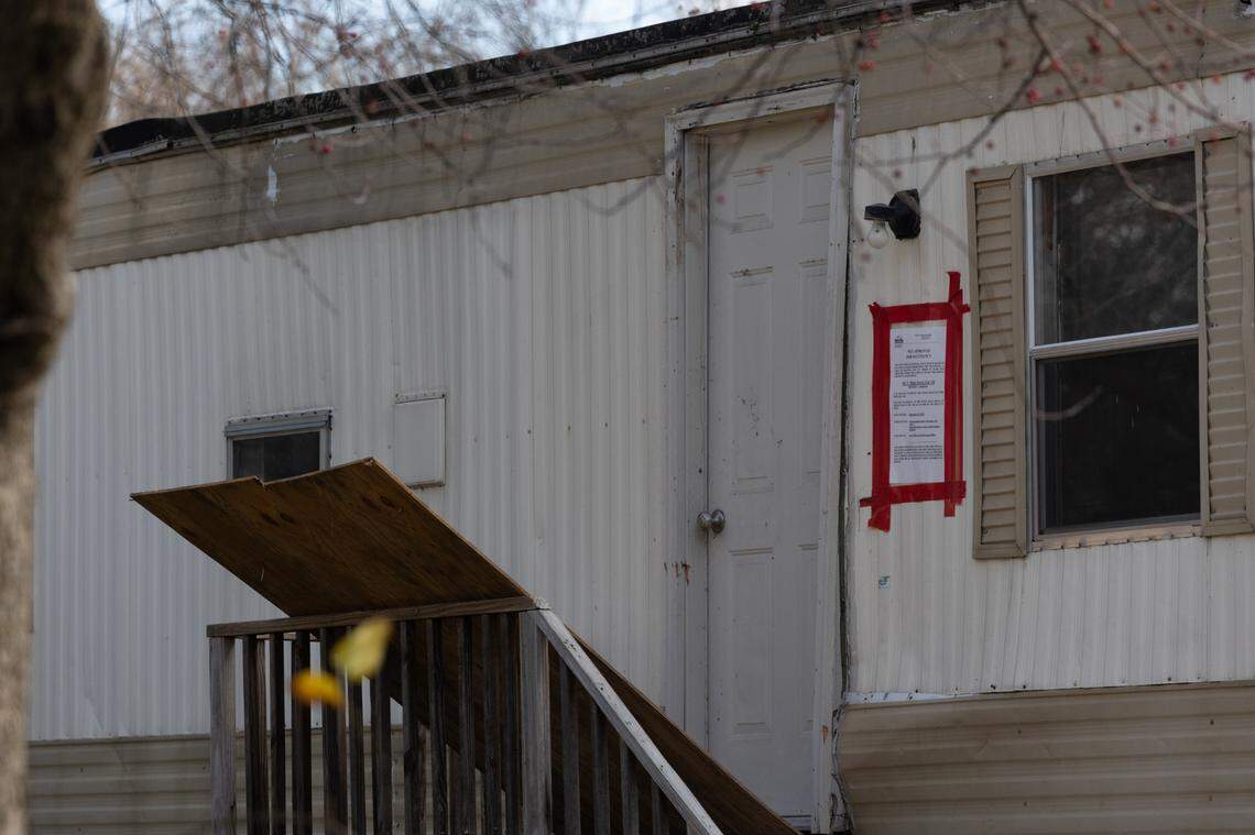 A sign is taped to the exterior of a mobile home at Lake Suzanne Mobile Home Park identifying it as condemned because of code violations. Between January 2022 and October 2024, the village of Shiloh condemned at least 23 mobile homes, village records show.
