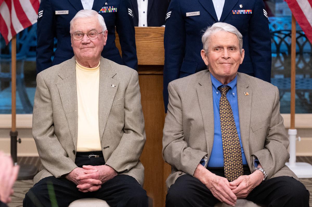 U.S. Navy Veteran Shelby Hamilton and U.S. Air Force Veteran Charles Butula are awarded for their prior service March 10 at the Belle-Scott Enlisted dinner in St. Clair County. The dinner was attended by airman from the 375th Air Mobility wing and the Belleville community. Community members along with Belleville Mayor, Patty Gregory and Chairman Mark Kern met with Scott personnel to enjoy a meal and build relationships. A few of many specially guests in attendance were Hamilton and Botula who were honored for their heroism in the service. These events bring Airmen and local civilians closer as they learn about and carry on the bond we have with this community.