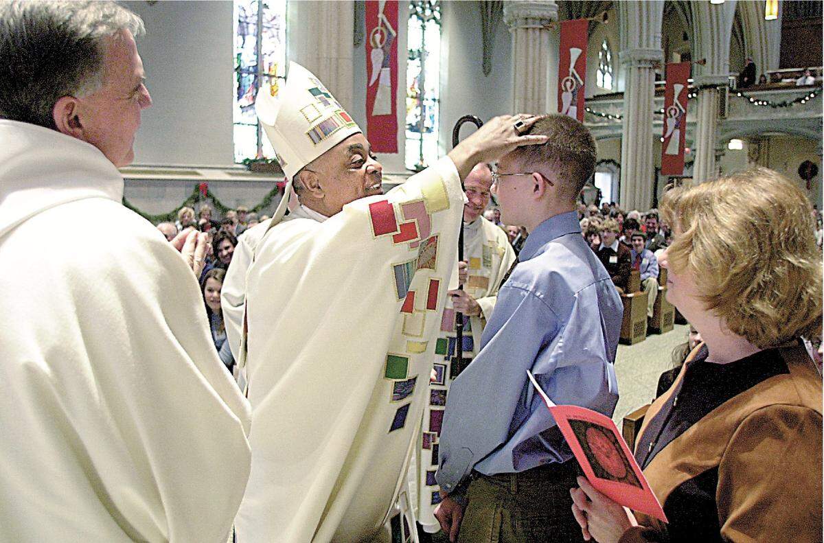 Archbishop-Designate Wilton D. Gregory confirms Kevin Welch in 2005, shortly before leaving Belleville to lead the Catholic Archdiocese of Atlanta.