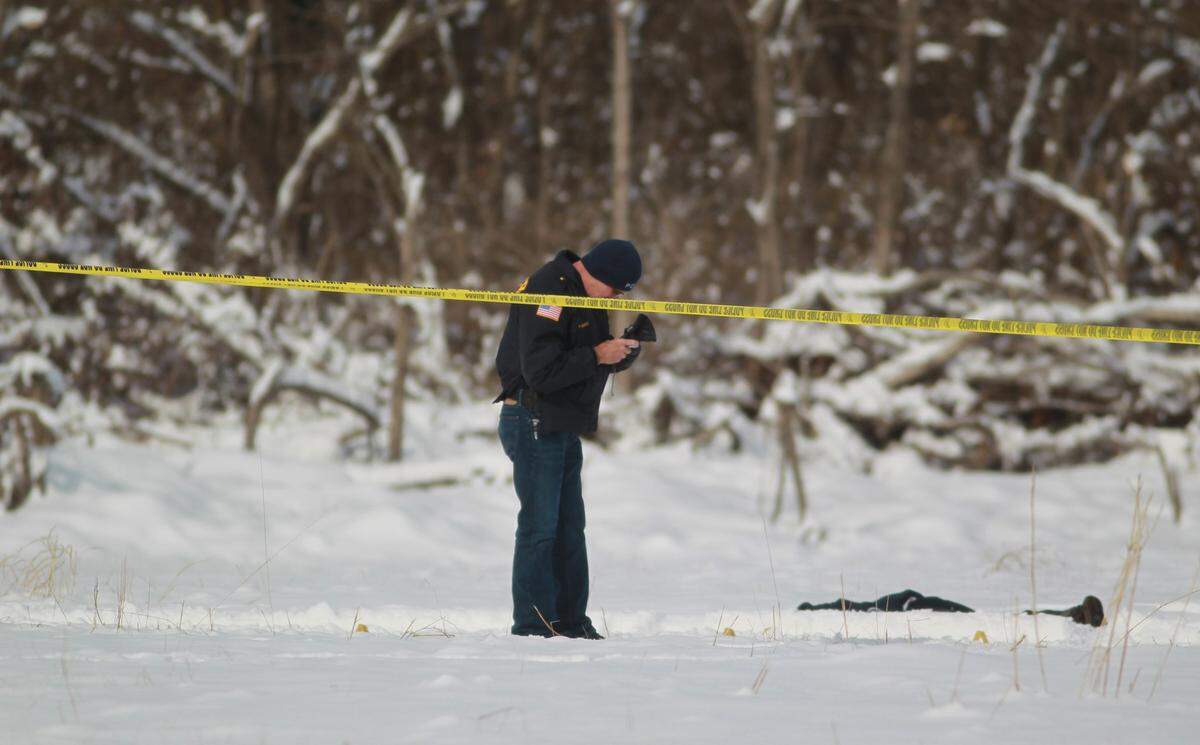 Police investigate a body found on North Park Drive near 37th Street in East St. Louis.