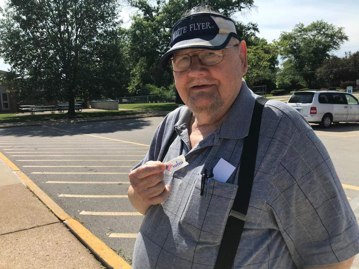 Van Horn, 84, of Belleville, shows off his “I voted” sticker after voting Tuesday at Douglas School. The retired newspaper pressman said he hasn’t sat out an election since 1968.