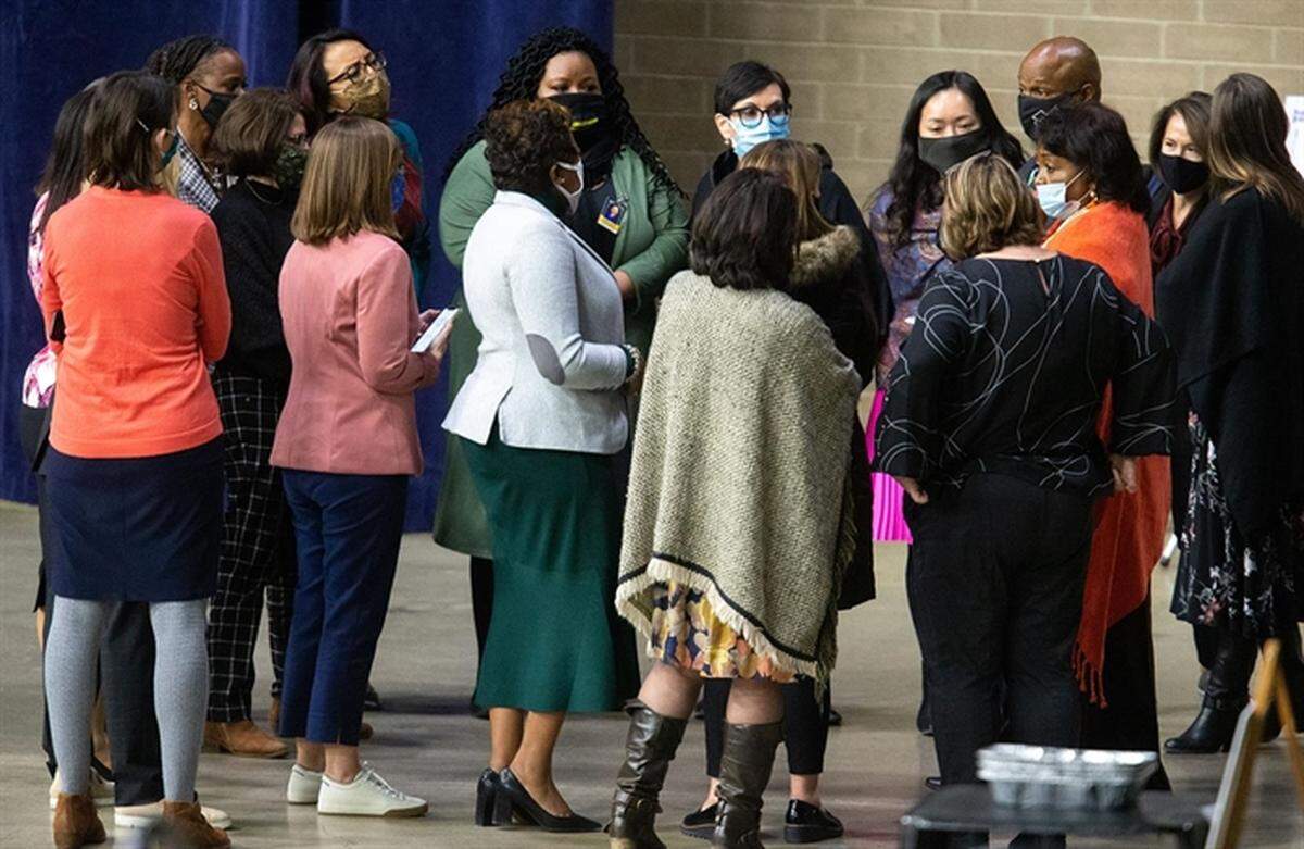 Members of the Illinois House Democratic Women’s Caucus speak with Rep. Emanuel “Chris” Welch on the floor of the Bank of Springfield Center on Jan. 12, 2021, the day before he was inaugurated as Speaker of the Illinois House of Representatives.