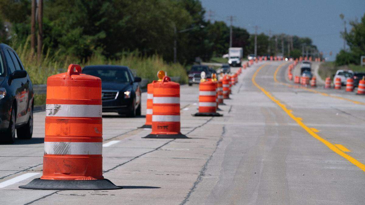 Cars drive past cones during construction on Frank Scott Parkway in this August 2023 file photo.