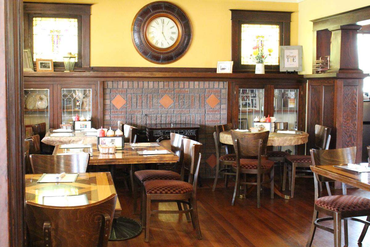 The living room of a Pierron home completed in 1920 serves as the Wooden Tie Cafe’s main dining room. The restaurant is filled with hardwood floors, massive woodwork and leaded- and stained-glass windows.
