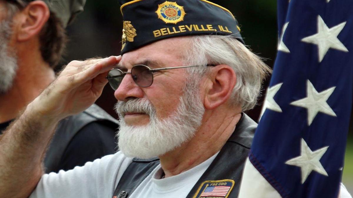 
Marine Corps veteran Terry Hobbs, of Freeburg, saluted during Taps at the 2014 Belleville Memorial Day ceremony at Walnut Hill cemetery.
