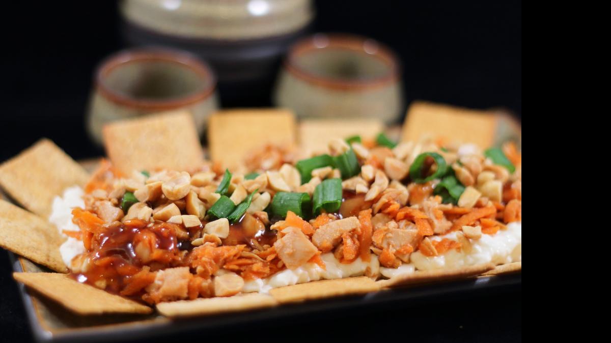 
Forget the ever-present Mexican dip and try this Asian-Inspired Layered Chicken Dip.
