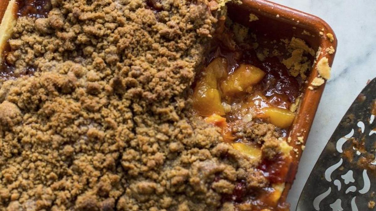 
A peach slab pie, with a cinnamon and ginger imbued streusel top.
