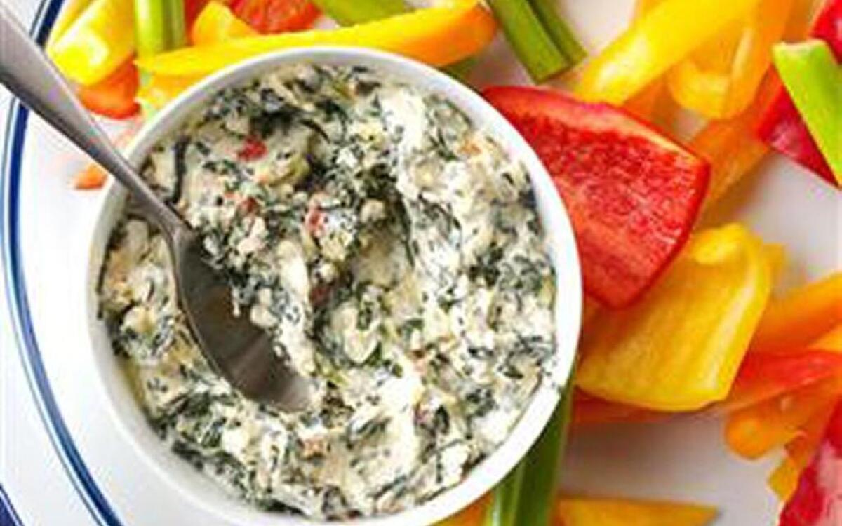 You make Sun-Dried Tomato Spinach-Artichoke Dip in the slow cooker.