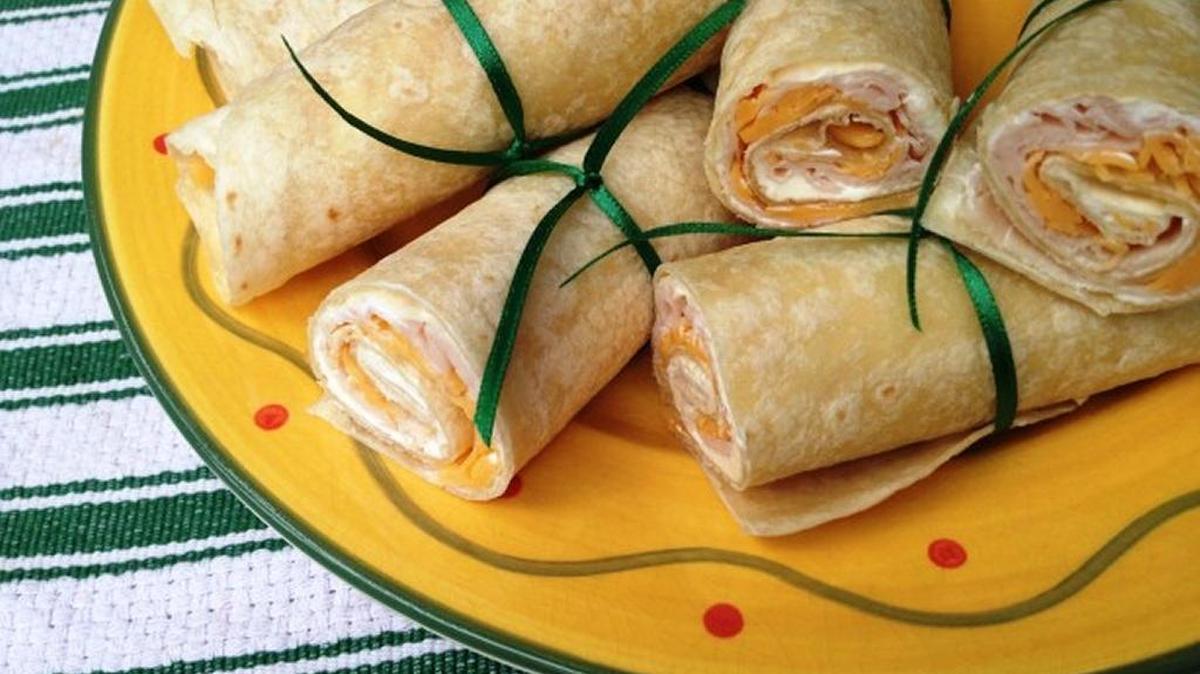 Diploma Rollups are trimmed tortillas stuffed with meat and cheese, then rolled up.