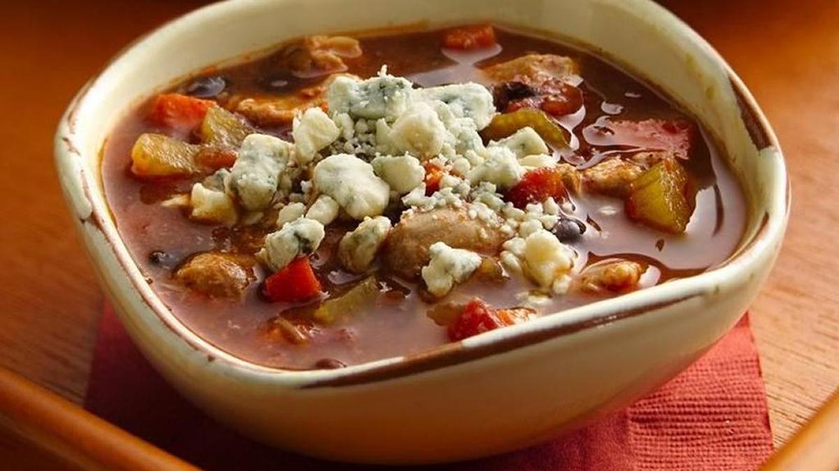Top Slow-Cooker Buffalo Chicken Chili with blue cheese.