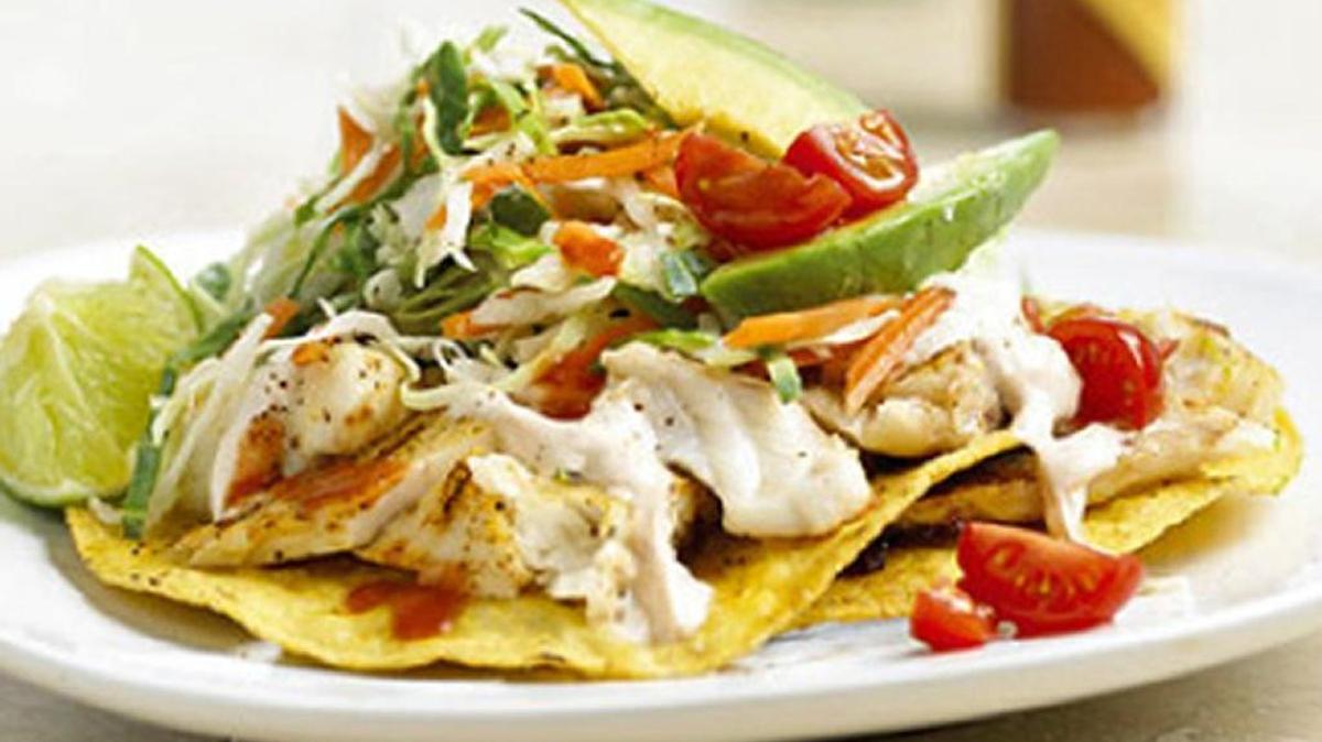 Fish tostadas are topped with a Chili-Lime Cream that’s easy to prepare.