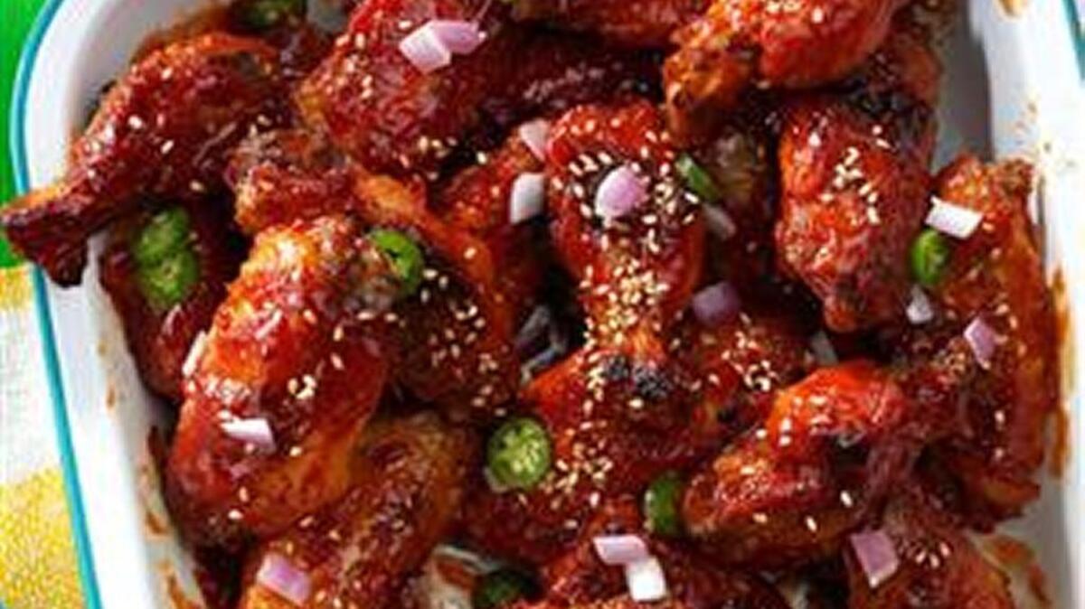 Sweet & Tangy Chicken Wings are made in the slow cooker.