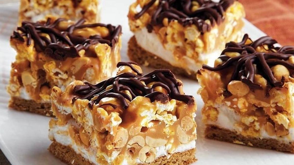 
Peanuts and popcorn are just two of the snacks you’ll find in this dessert.

