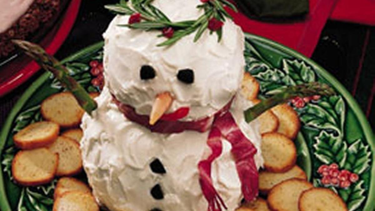 Deck your snowman cheese ball out in holiday edible gear.