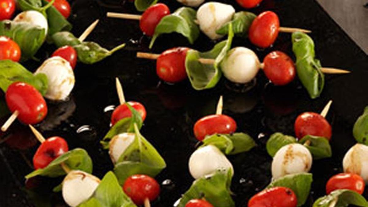 Caprese Salad Kabobs skewer cheese, basil and tomatoes.