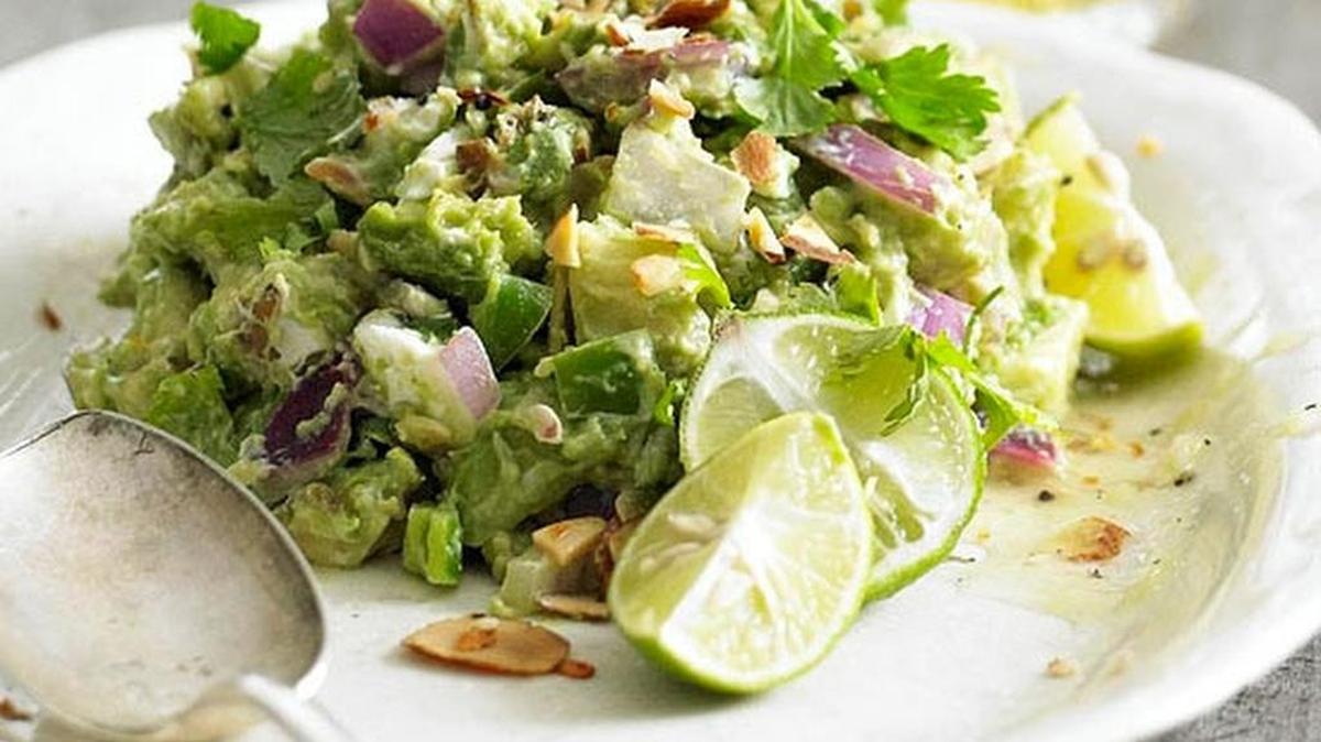 
Toasted almonds and feta cheese add a little something extra to guacamole.
