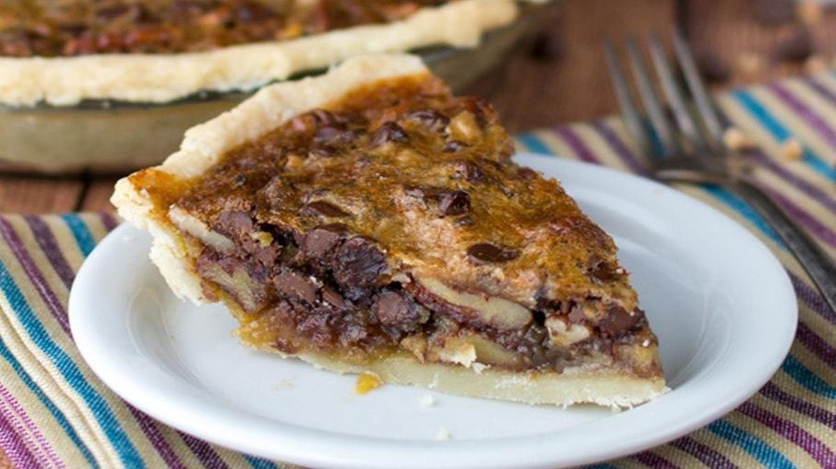 Pecan pie gets toffee and chocolate pieces added to make it even better.